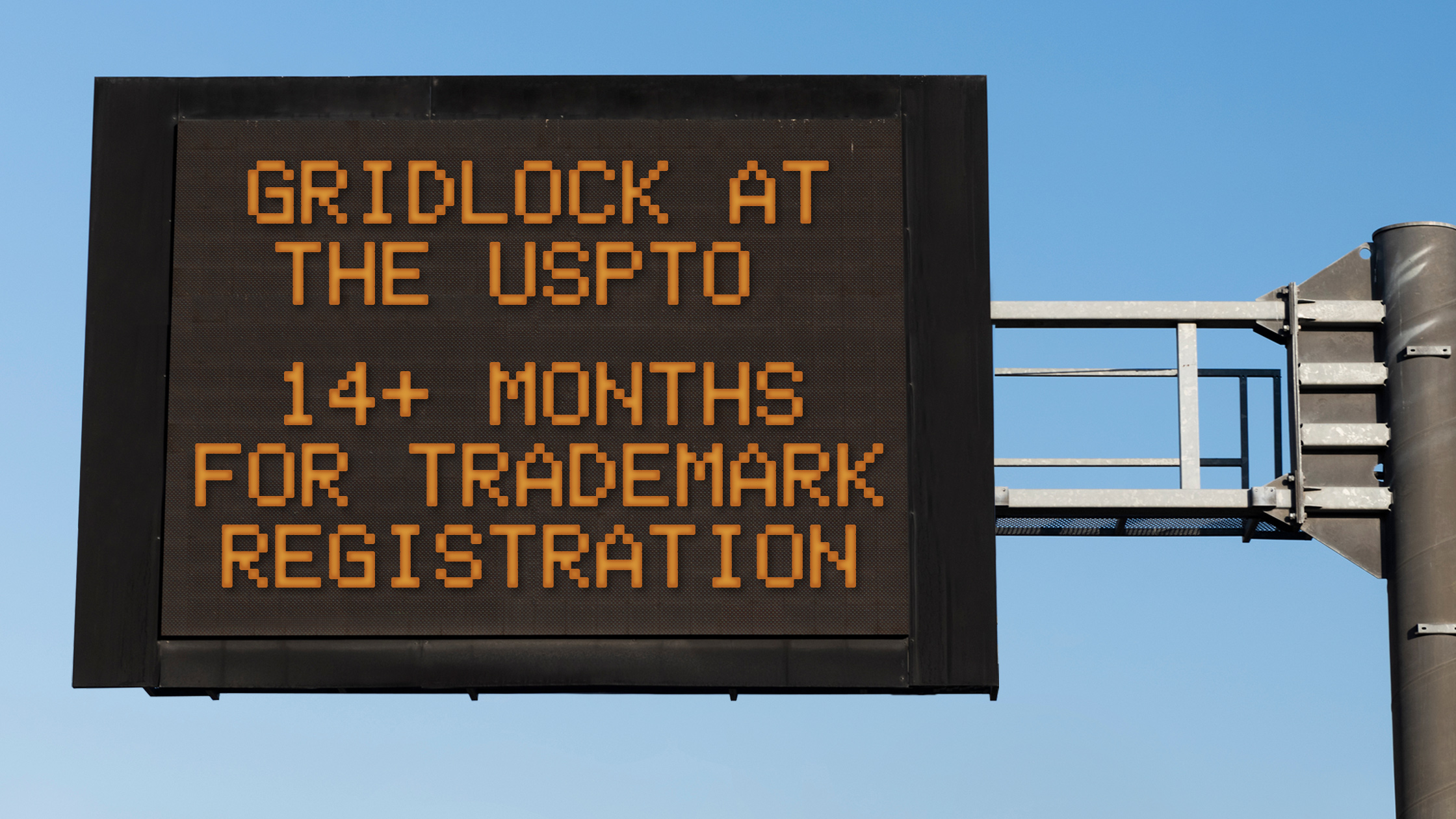 Digital Road Sign with the warning: "Gridlock at the USPTO 14+ Months for Trademark Registration"